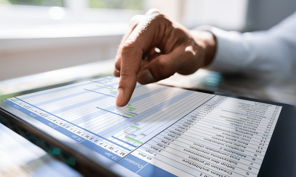 man checking statistics on a tablet